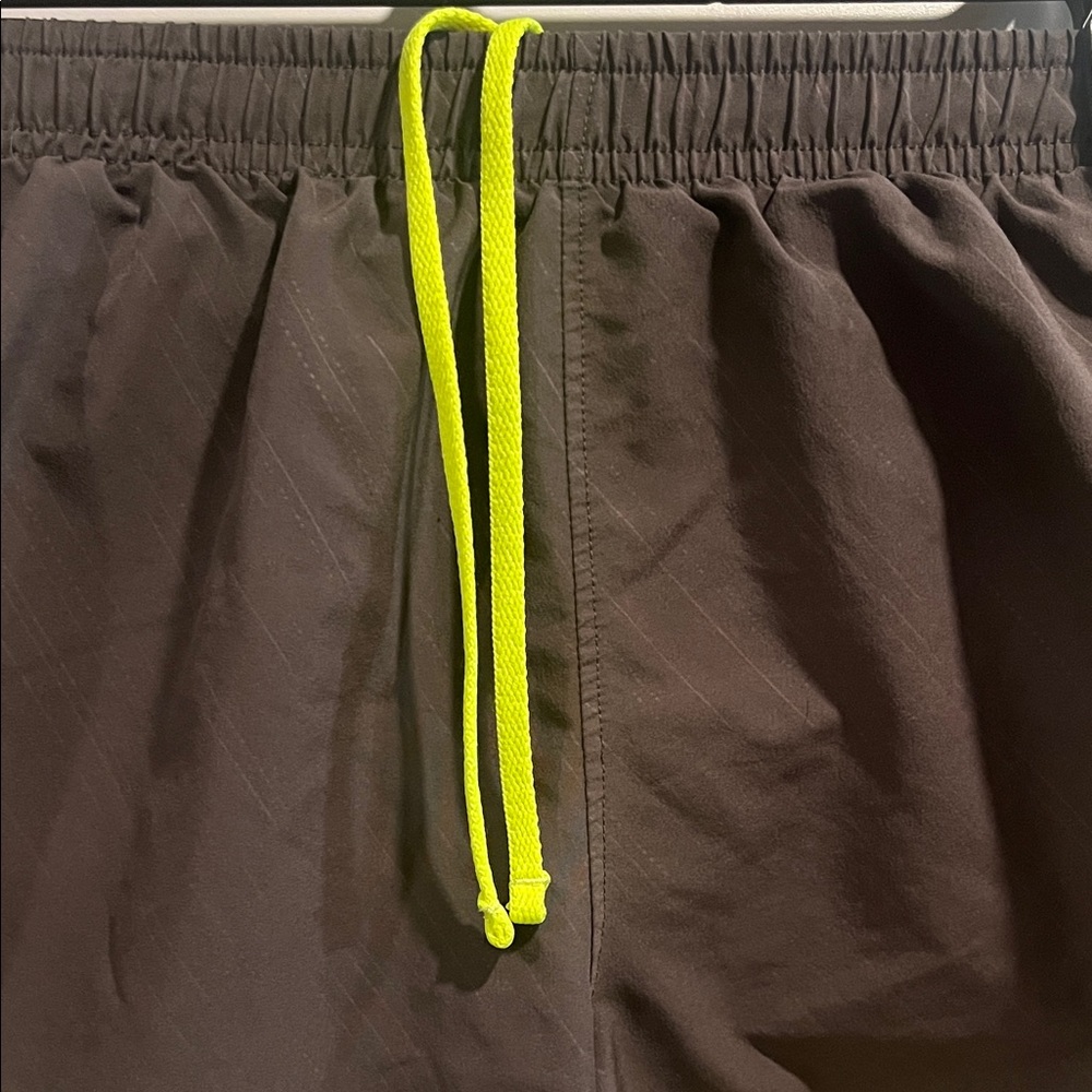 Under Armour Run Women's Black Shorts with Neon Yellow Trim - Picture 3 of 8